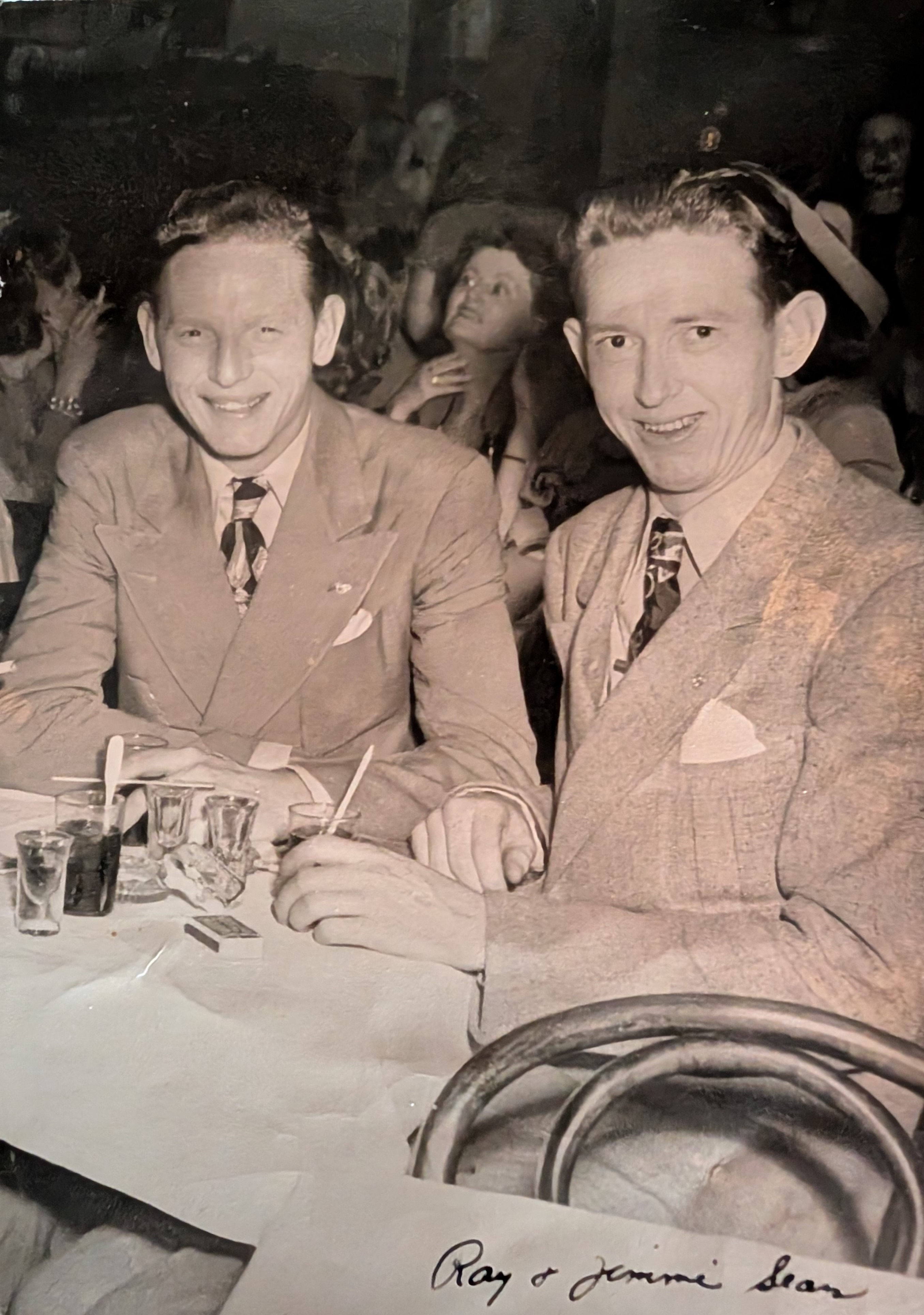 Framed sepia photograph of Ray and Jimmie Sears, two young men in suits, smiling